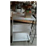 Metal shelves with planter, three metal shelf