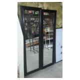 Two black framed door mirrors. Each is