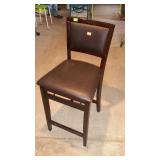 Upholstered folding bar stool. 24" seat height.