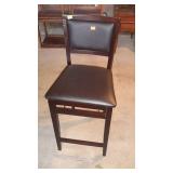 Upholstered folding bar stool. 24" seat height.