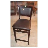 Upholstered folding bar stool. 24" seat height.