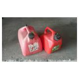 Two poly gas cans 1.25 gallon, and 2.5 gallons