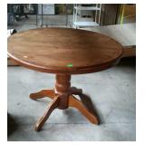 Round top dining table, measures 42 inches in