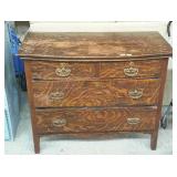 Two over two dresser with bow front top and tiger