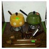 Fondue party group, two fondue pots with stands