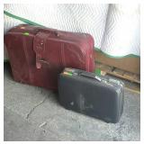 Two suitcases one is American Tourist