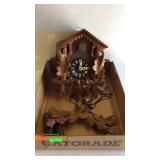 Stag coo-coo clock with pineapple weights, and