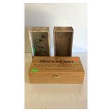 Three wooden boxes, one Mouton Cadet wine, and 2