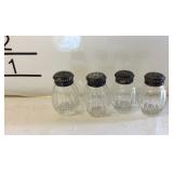 Four mini salt and pepper shakers Sterling rimmed