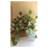 Artificial arrangement in wicker planter basket