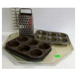 Tin kitchen ware - grater and five muffin tins