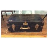 Early black foot locker trunk