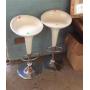 Two plastic seated swivel bar stools, measures 33