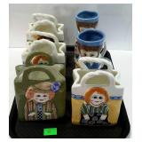 Ceramics - four purse shaped, and two mugs - all