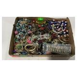 Flat of costume jewelry