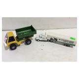 Two toy trucks, one John Deer tractor trailer,