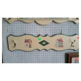 Wall hanging hat/coat rack. Birdhouse motif.