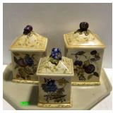 Three ceramic kitchen canisters, fruit decor