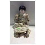 Porcelain baby doll in early design gown