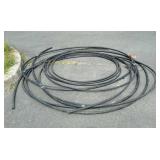 1" black plastic water line pipe several feet in