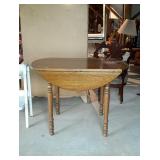 Round drop leaf oak kitchen table with turned