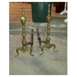 Brass andirons. One needs tightened