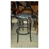 Wooden bar stool with vinyl padded seat. 15"