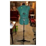 Green half body mannequin with base