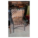 Single patio chair. Woven straps, metal frame.