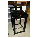 Single barstool with foot rail and low back. Seat