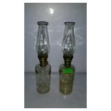 Two clear glass oil lamps 10in tall