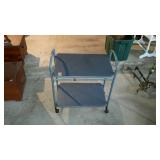 Folding, two-tiered tea cart. Blue in color. Made