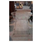 Early wrought iron fernery, with undershelf,