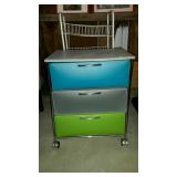 Storage group. Wire shelves and a rolling drawer