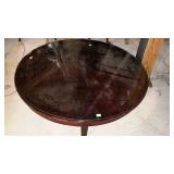 Round glass top table, measures 48 inches in