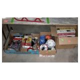 Three boxes with puzzles, vhs tapes, misc