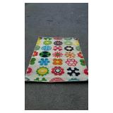 Wool oriental rug with flowers on it, does need