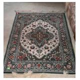 Wool oriental rug, measures 62, inches long, by