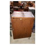 Wooden storage cabinet, measures 24 inches long,