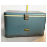 Older metal cooler with drop handles by
