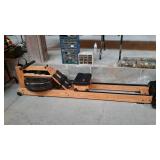 Water Rower - 83" long by 21" wide - has wheels