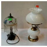 Group of two home decor lamps, one lamps cord has