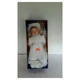 Porcelain doll baby in box