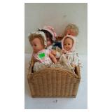 4 doll babies with basket bed