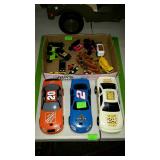 Three nascsr cars and flat of toy cars