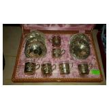 Silver plate teacups and saucers in case