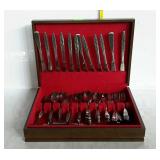 Silver chest with assorted stainless flatware