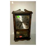 Regulator wall clock with broken arch top,