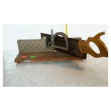 Older craftsman miter saw with saw and box