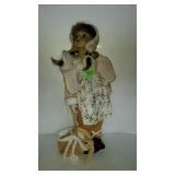 Porcelain doll with dog in purse, 24" tall with
